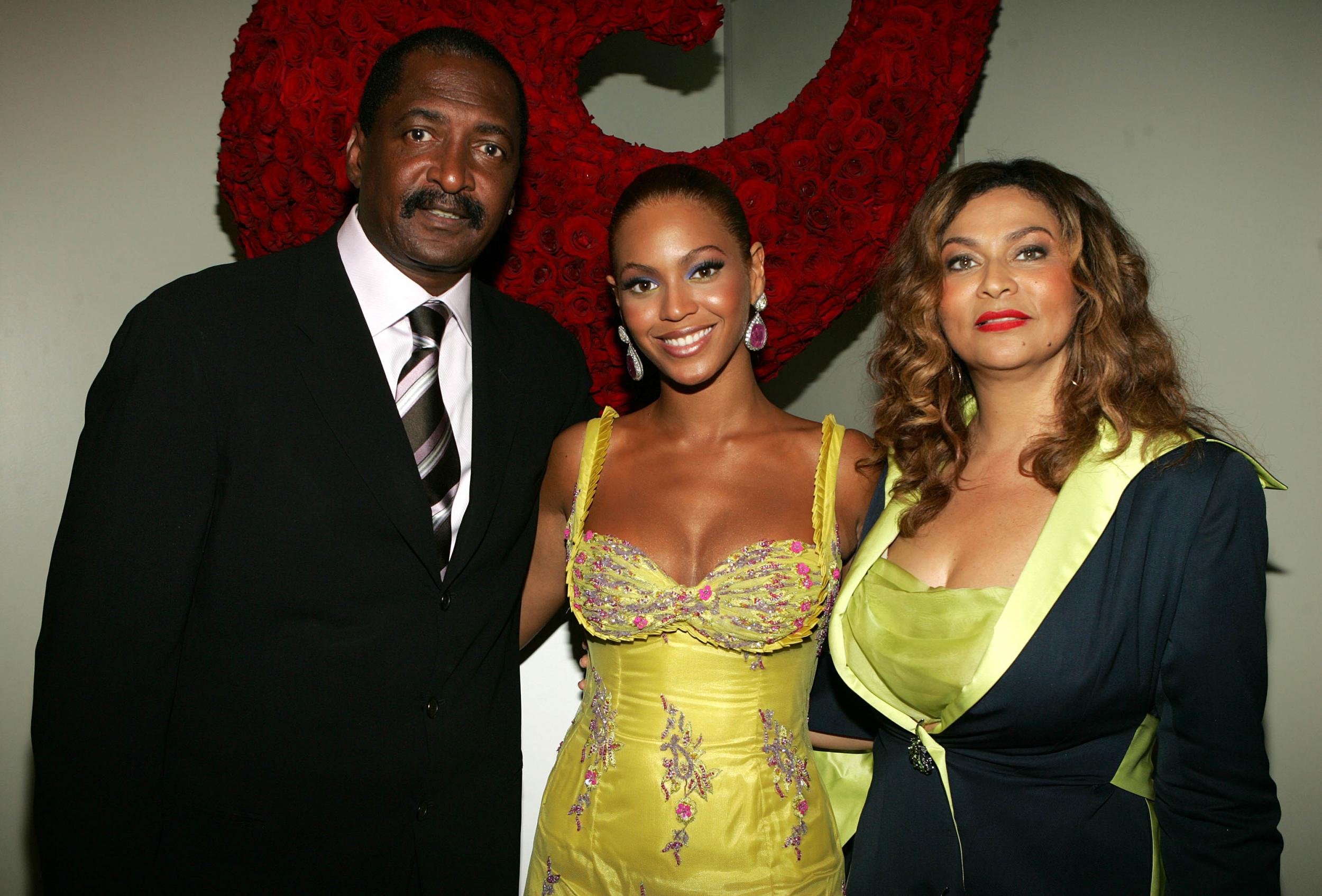 Beyonce with her father and former manager Matthew Knowles and Tina Knowles at the 'Beyonce: Beyond the Red Carpet auction in June 2005. They have since divorced.