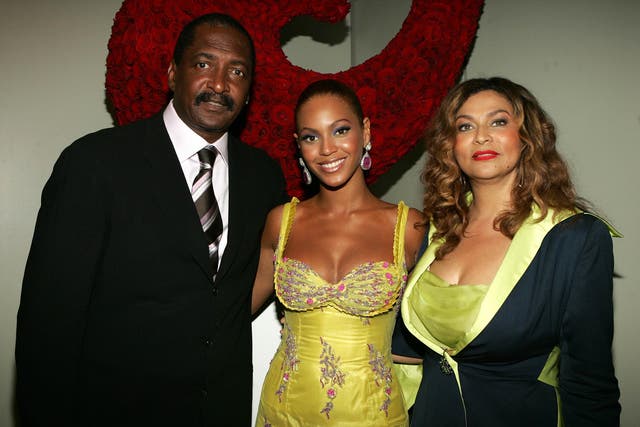 Beyonce with her father and former manager Matthew Knowles and Tina Knowles at the 'Beyonce: Beyond the Red Carpet auction in June 2005. They have since divorced.