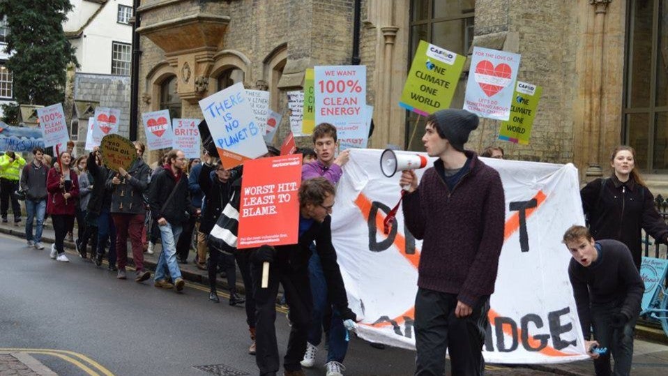 The group, pictured, marches through Cambridge in a protest in November 2015