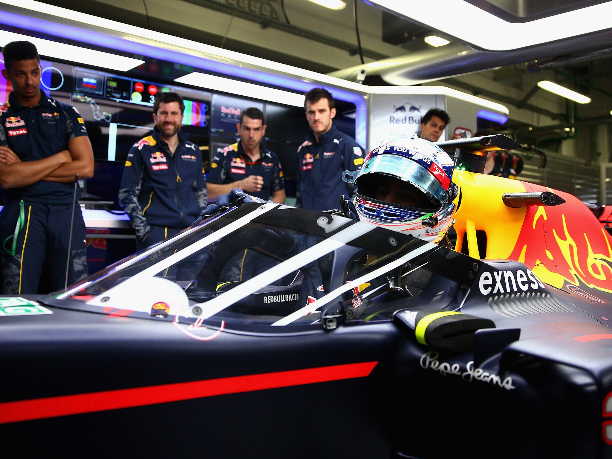 Daniel Ricciardo sits in the Red Bull with the new safety canopy attached