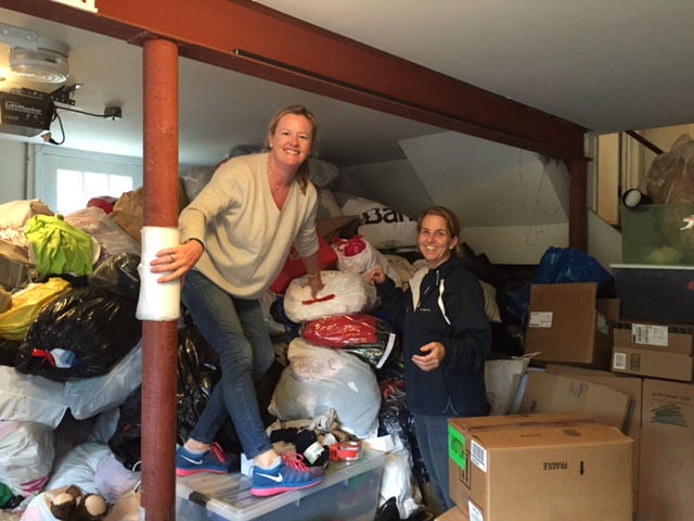 &#13;
Kirsten MacDonald and Margaret Anker sort out hundreds of boxes of donations&#13;