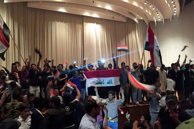 Followers of Shia cleric Moqtada al-Sadr in the parliament building after they stormed Baghdad's Green Zone in Iraq April 30, 2016.