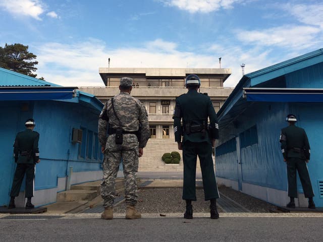 South Korean soldiers look at the North side while US Defense Secretary Ashton Carter visits the truce village of Panmunjom in the Demilitarized Zone dividing the two Koreas in 2015