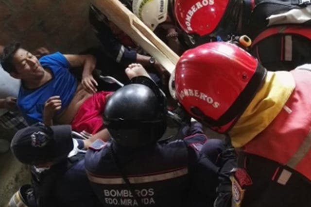 A visiting Venezuelan task force rescued the man after 13 days under the rubble