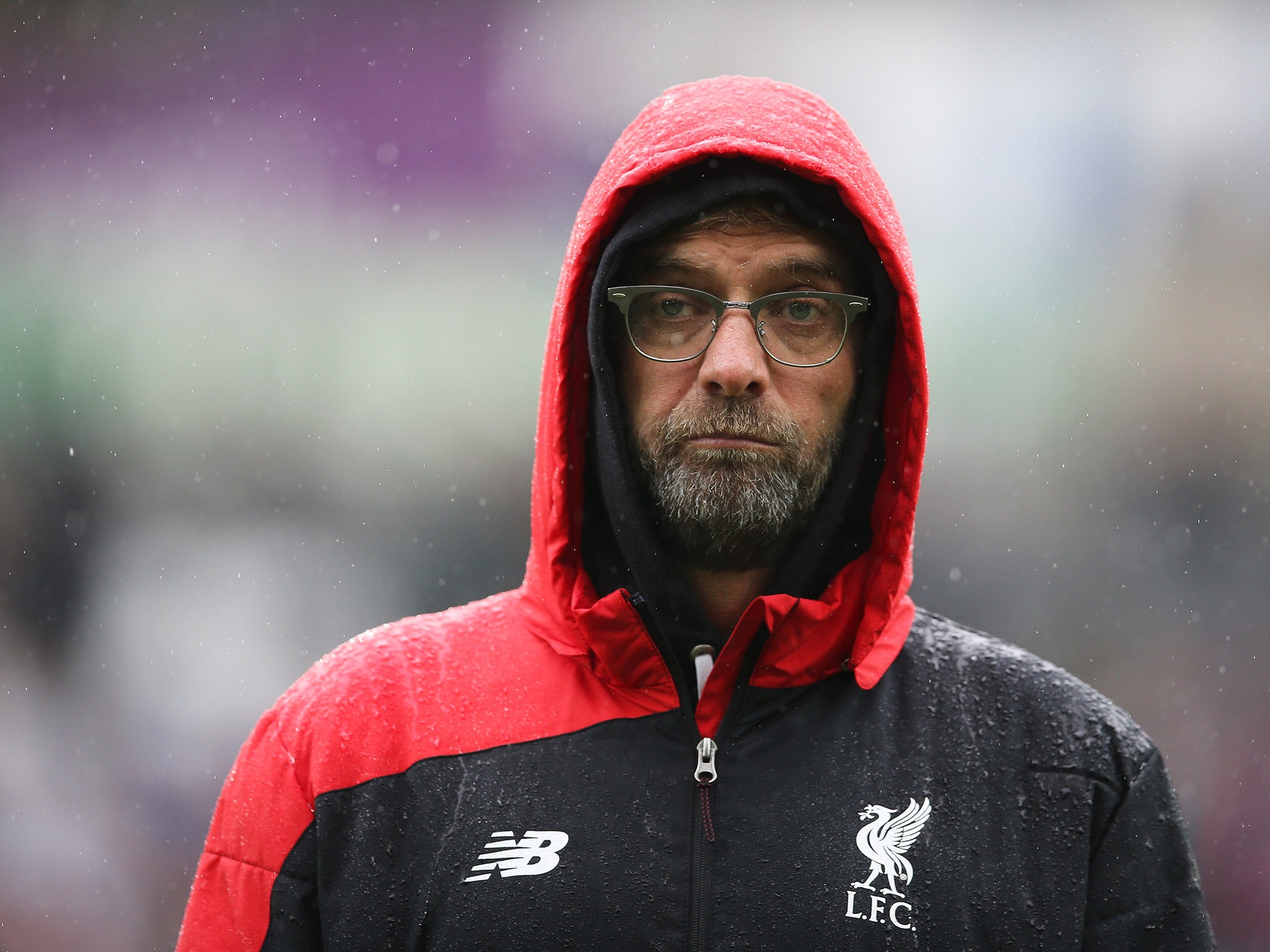 Jurgen Klopp stands in the rain during Swansea vs Liverpool