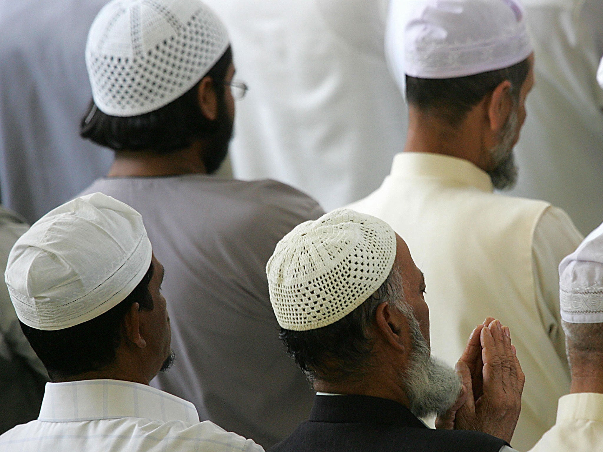 British muslims pray during Friday prayer at an East London mosque