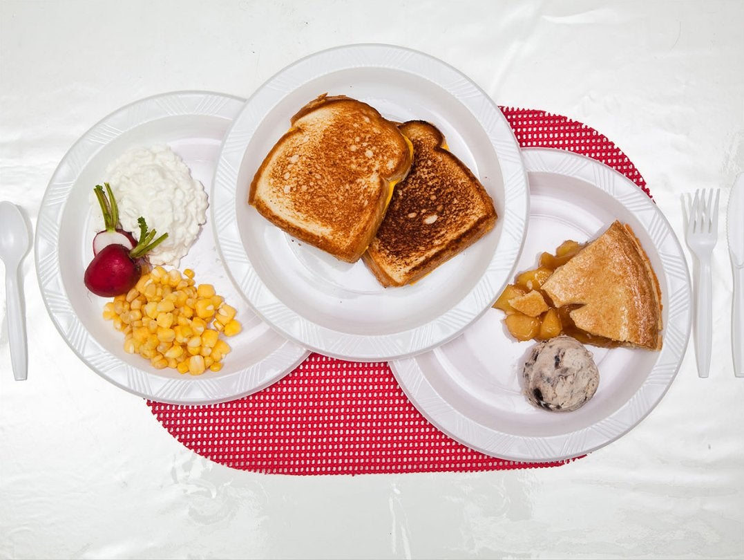 Two grilled cheese sandwiches, pint of cottage cheese, Hominy/corn mixture, peach pie, chocolate-chip ice cream, radishes