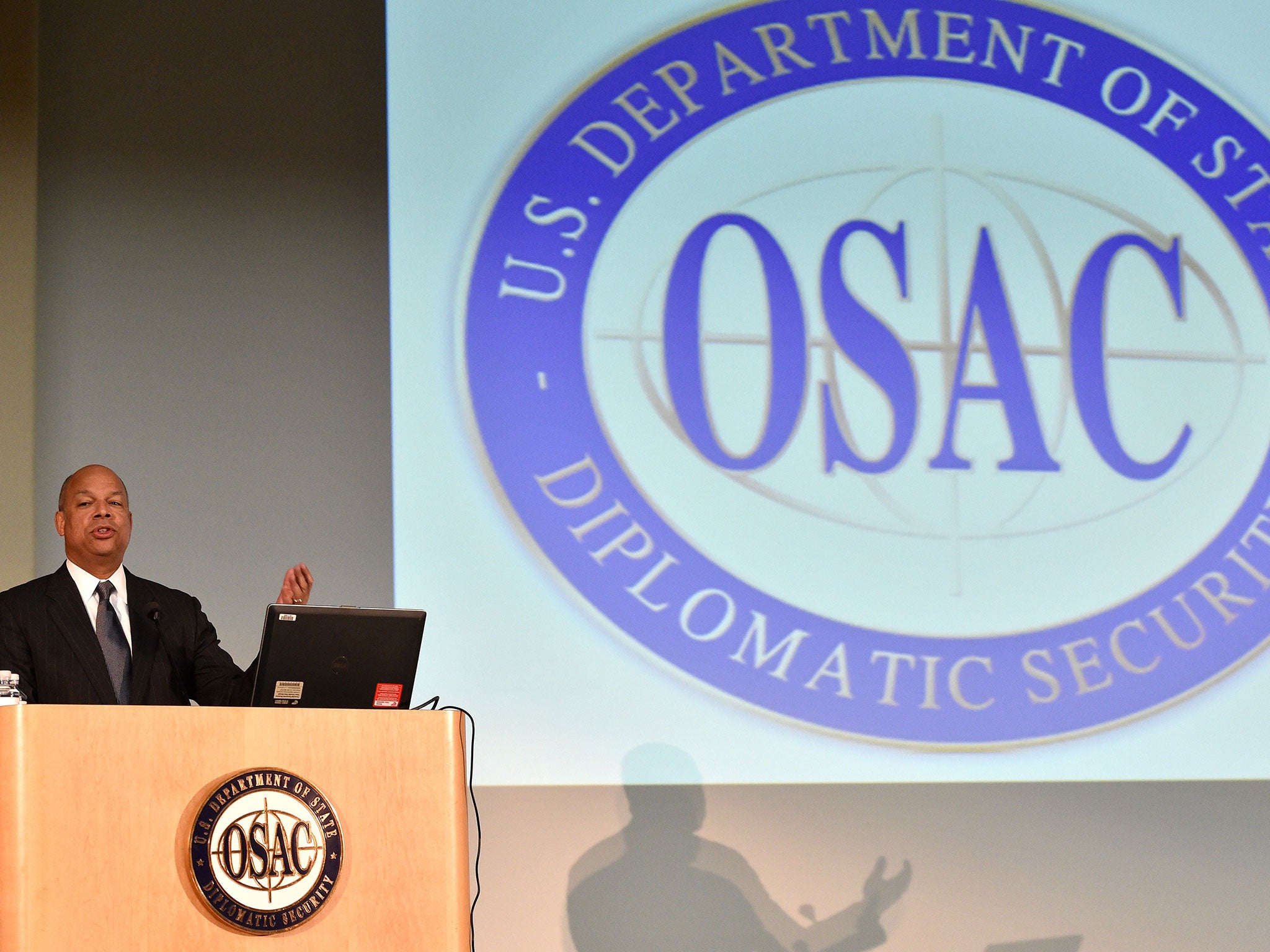 Department of Homeland Security Secretary Jeh Johnson addresses the audience during the Overseas Security Advisory Council (OSAC) annual meeting at the State Department in Washington, DC