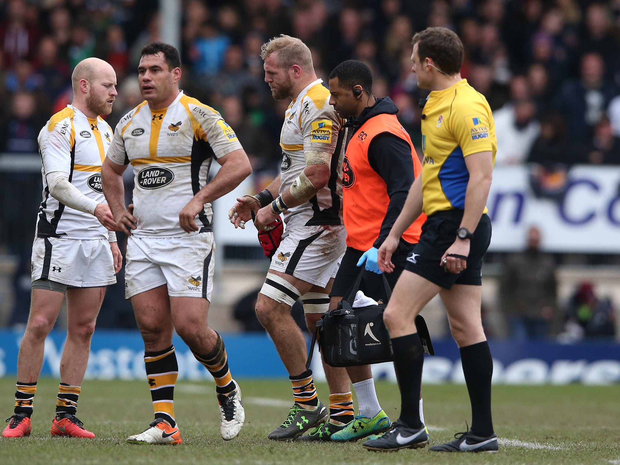 James Haskell leaves the field after suffering a shoulder injury