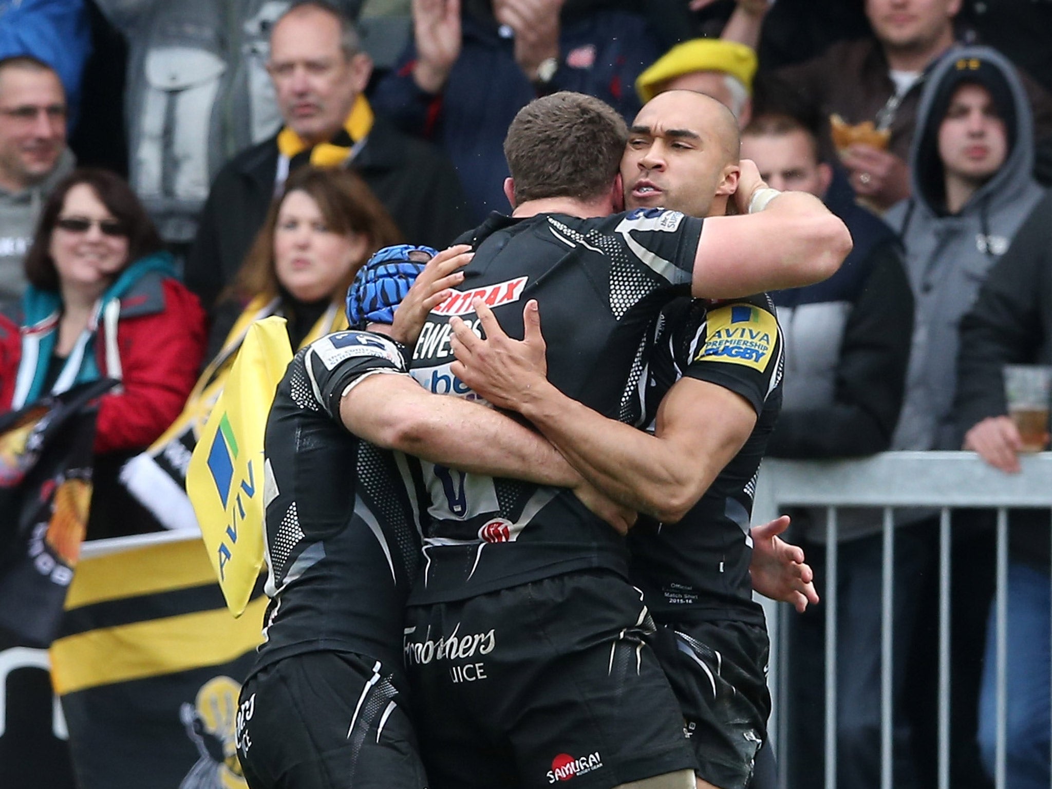 Exeter players celebrate after Olly Woodburn scores the opening try