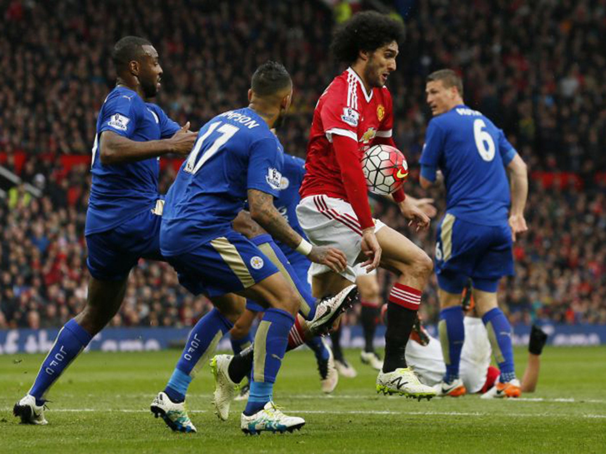 Marouane Fellaini appeared to elbow Robert Huth in the face