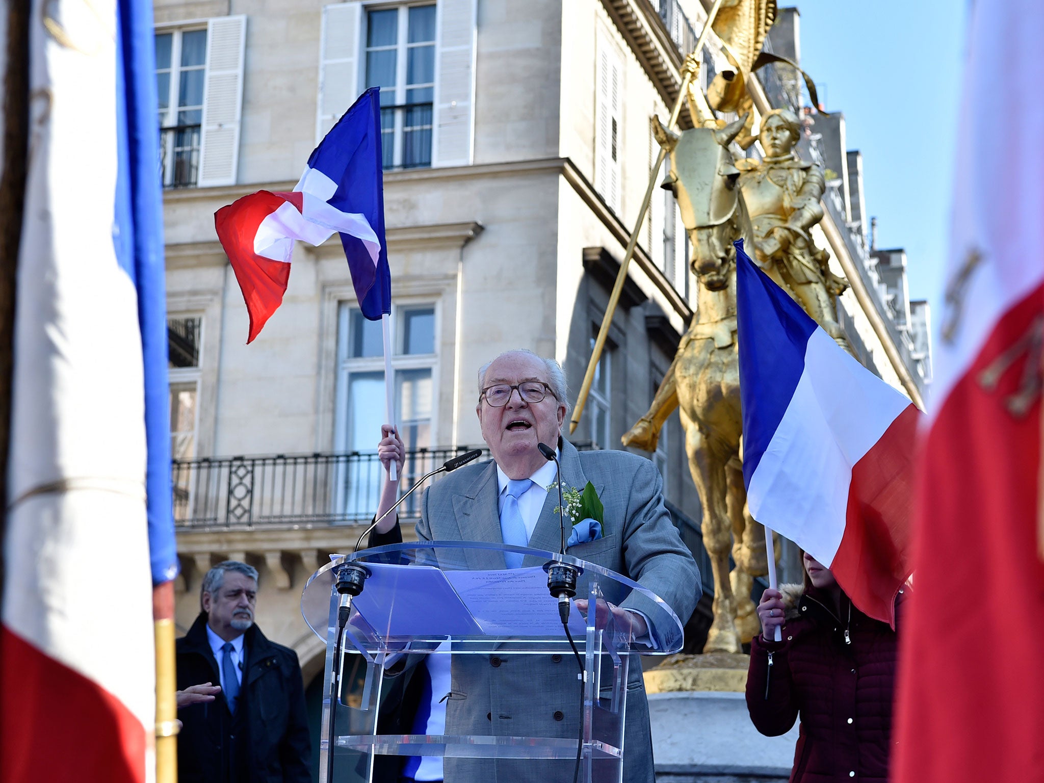 Jean-Marie Le Pen speaking at Front National celebrations in front of a statue of Joan of Arc