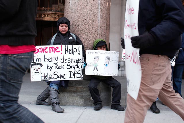 Protesters outside the Michigan State building during a January 2016 sickout <em>Bill Pugliano/Getty</em>