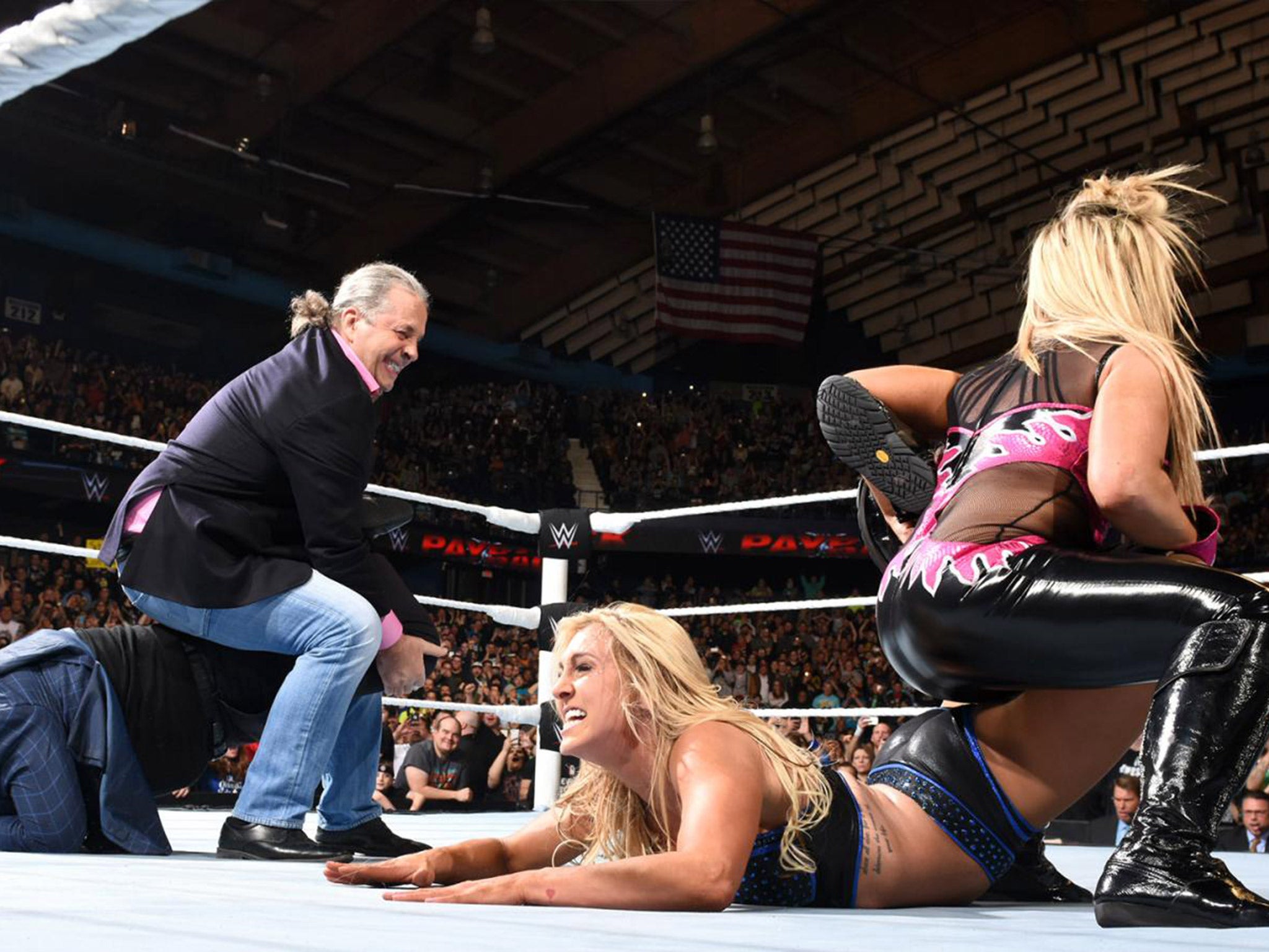 Bret Hart and Natalya lock Charlotte and Ric Flair in the Sharpshooter