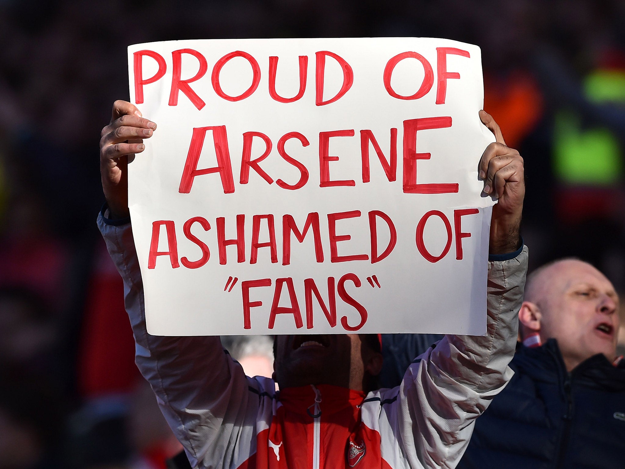 An Arsenal fan shows his support for Arsene Wenger