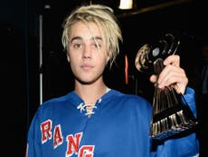 Justin Bieber condemned by PETA for posing with captive tiger