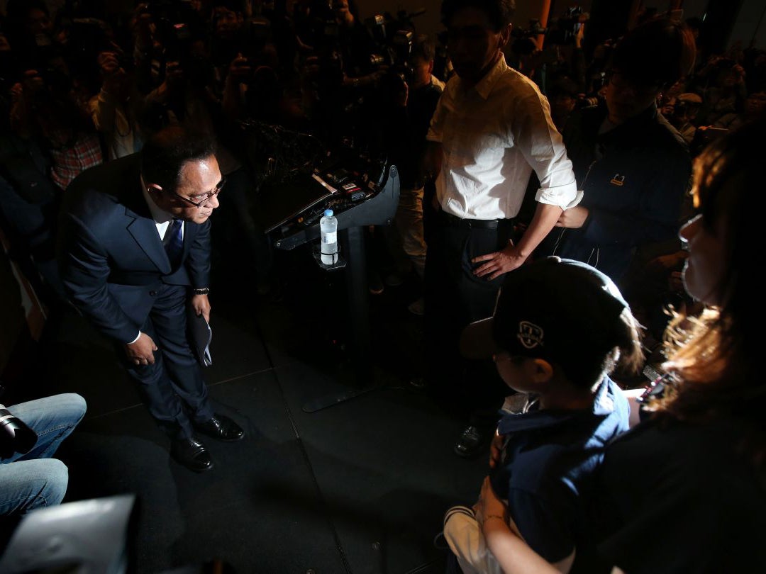 Atar Safdar, the head of Oxy Reckitt Benckiser Korea, bows during a press conference at a hotel in Seoul