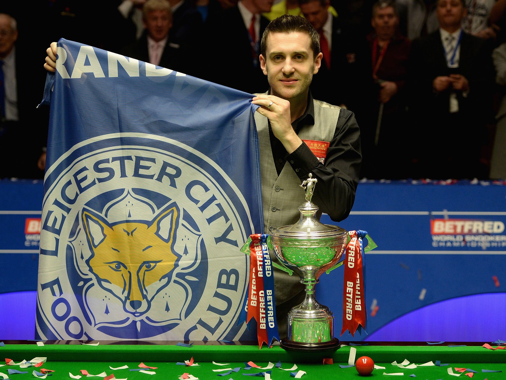 Mark Selby celebrates his victory at the Crucible