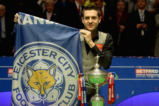 Mark Selby celebrates his victory at the Crucible