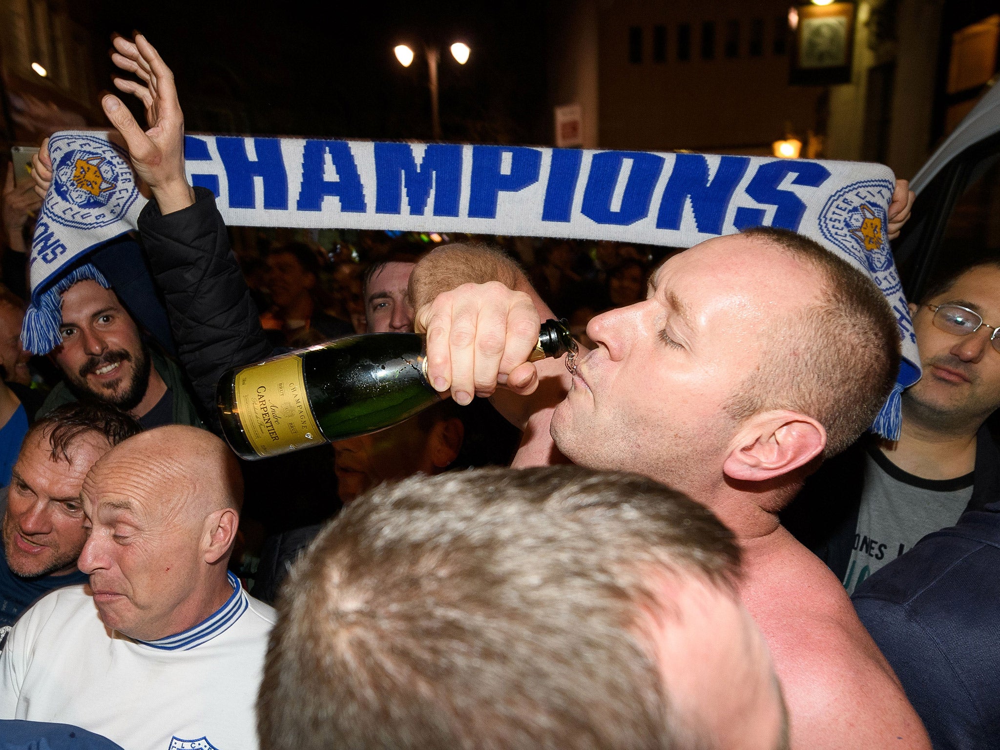 Leicester fans celebrate the club's Premier League success on Monday night