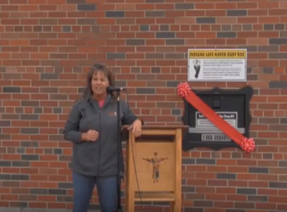Monica Kelsey opening Indiana's first baby box at Woodburn fire station