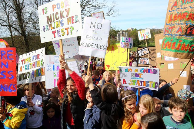 Parents hold a rally with their children in Preston Park, Brighton, in protest at controversial SATs tests for six and seven-year-olds
