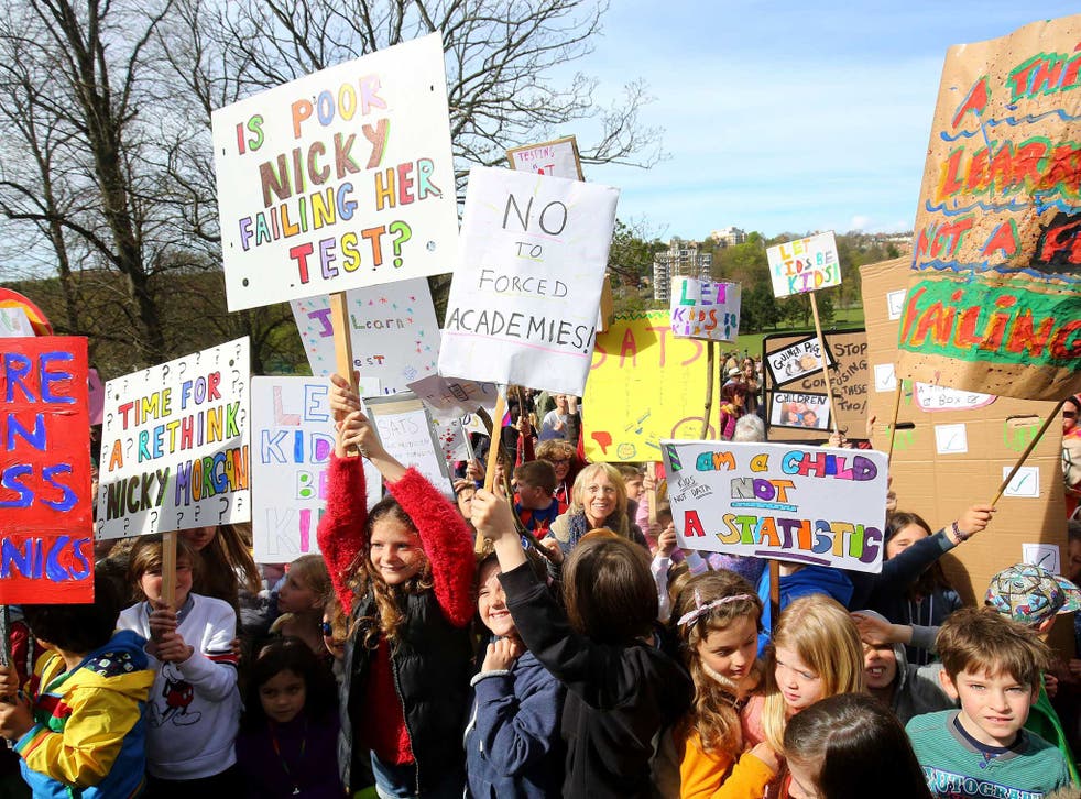 Parents hold a rally with their children in Preston Park, Brighton, in protest at controversial SATs tests for six and seven-year-olds