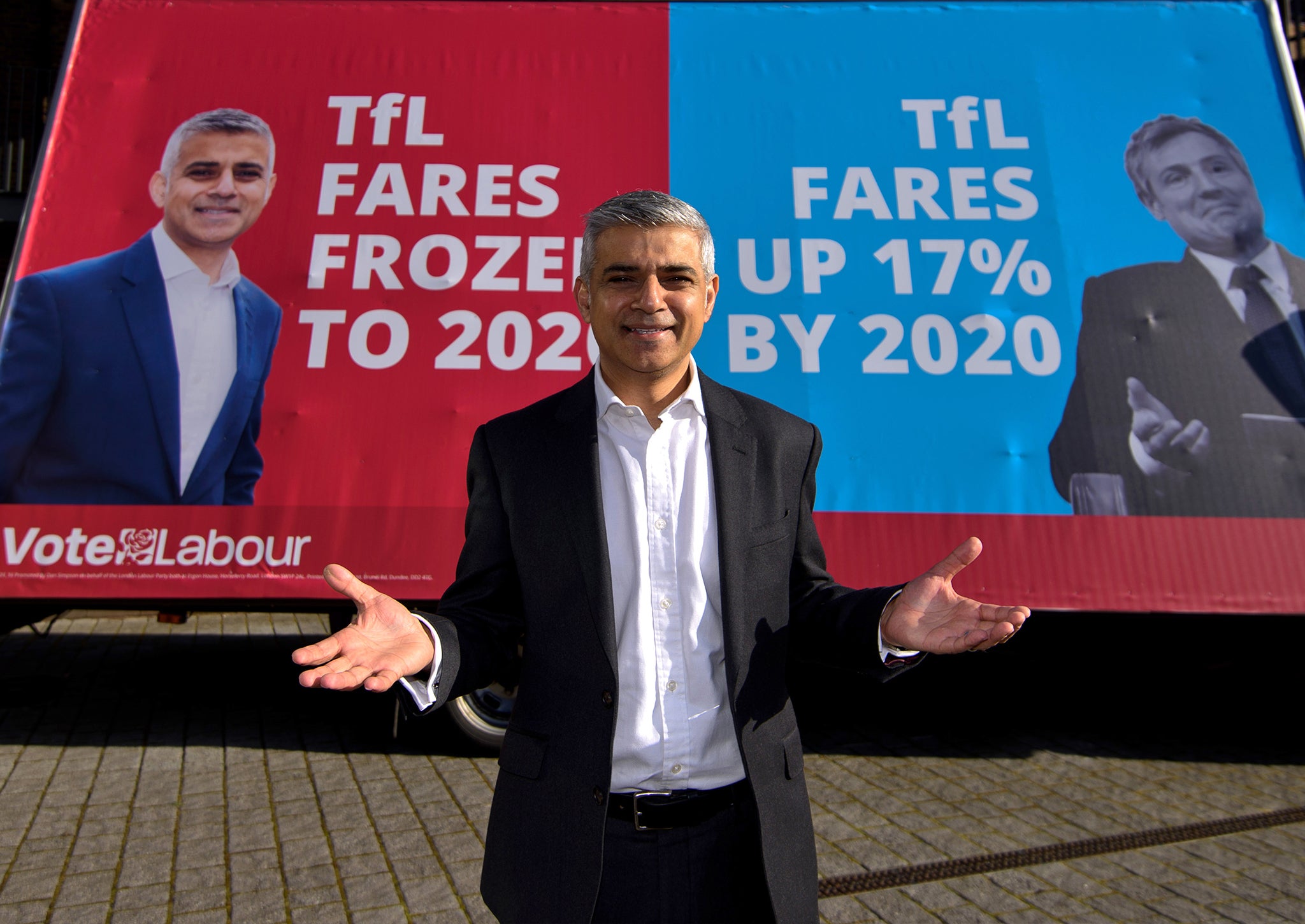 Sadiq Khan poses next to his new campaign poster on March 29, 2016 in London (Ben Pruchnie/Staff)