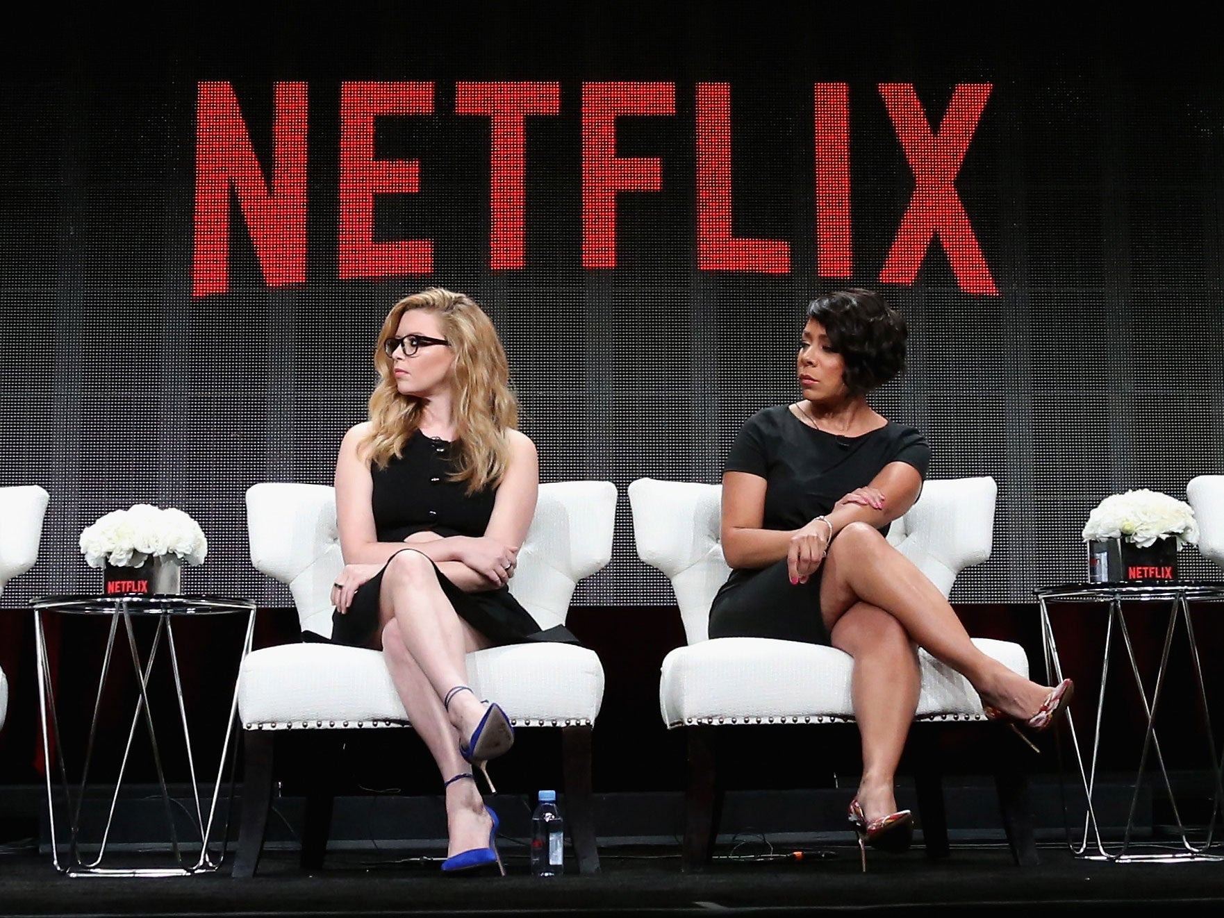 Orange is the New Black actors Natasha Lyonne and Selenis Leyva appear on stage at a panel discussion in July 2015