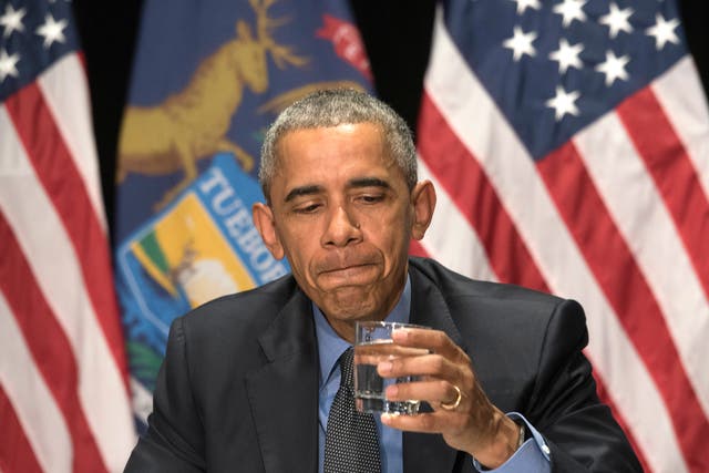 Mr Obama takes a sip of filtered Flint water to encourage residents <em>AP</em>