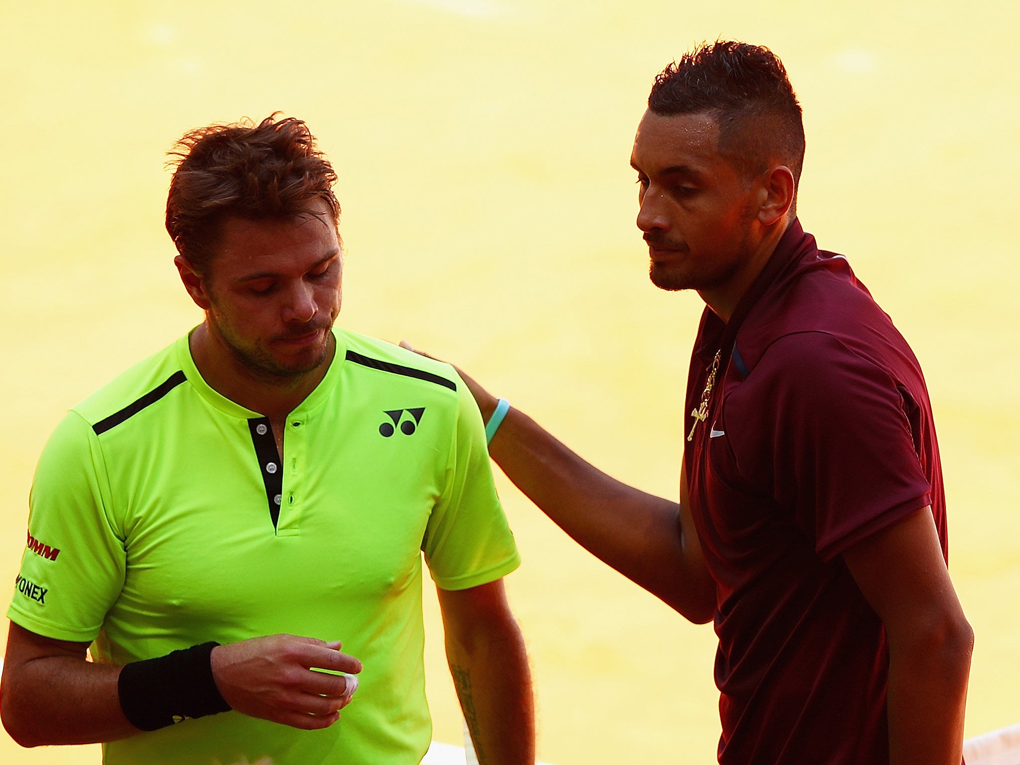 Stan Wawrinka and Nick Kyrgios embrace after the match