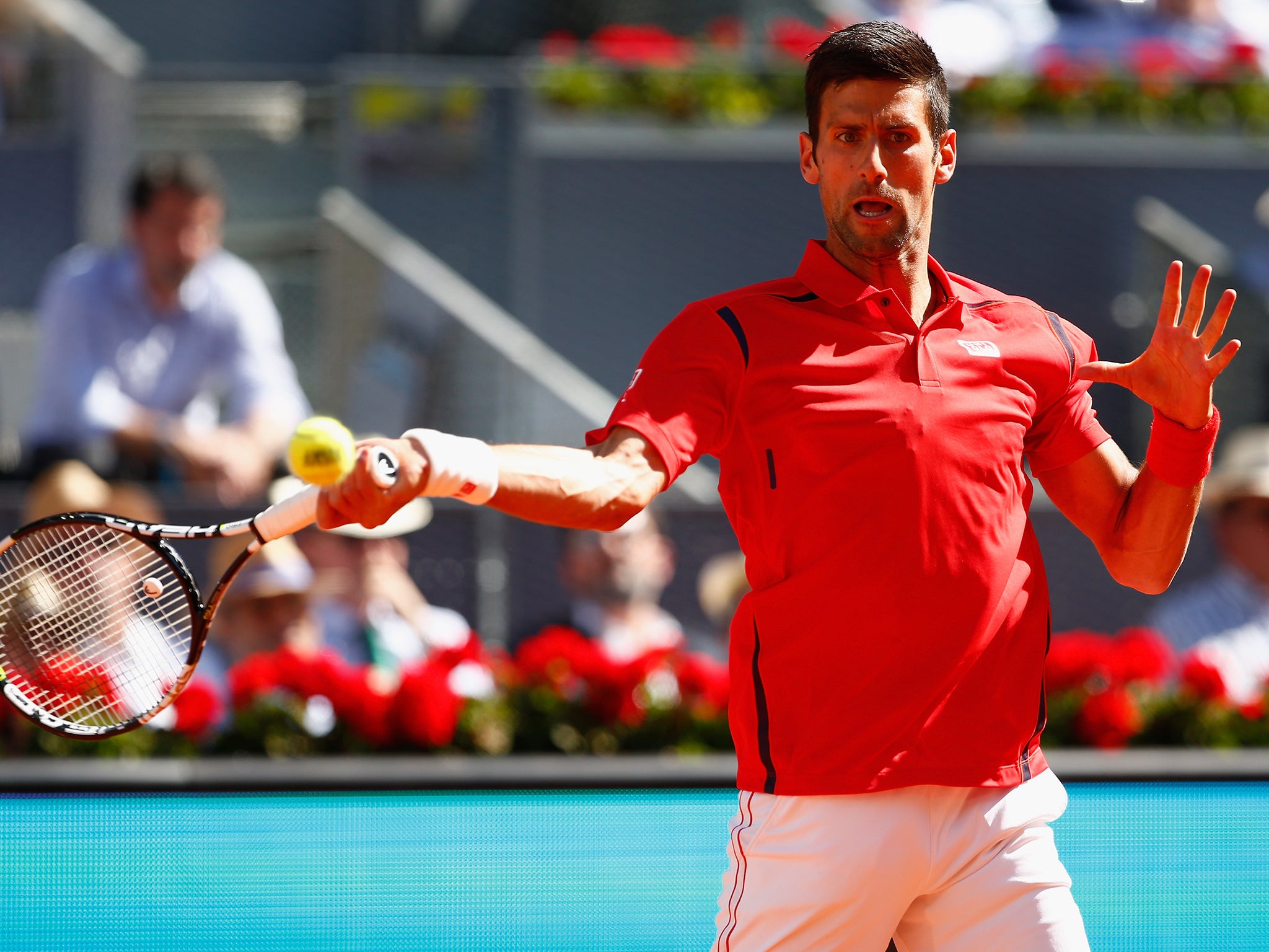 &#13;
Novak Djokovic plays a return&#13;
