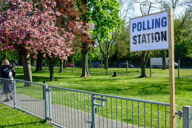 People vote at polling station in London, on May 5, 2016