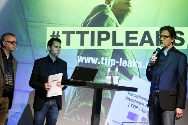 Juergen Knirsch (L-R), Volker Gassner and Stefan Krug of the environmental campaign group Greenpeace address a news conference as they present a copy of the leaked TTIP negotiations in Berlin, Germany, May 2, 2016