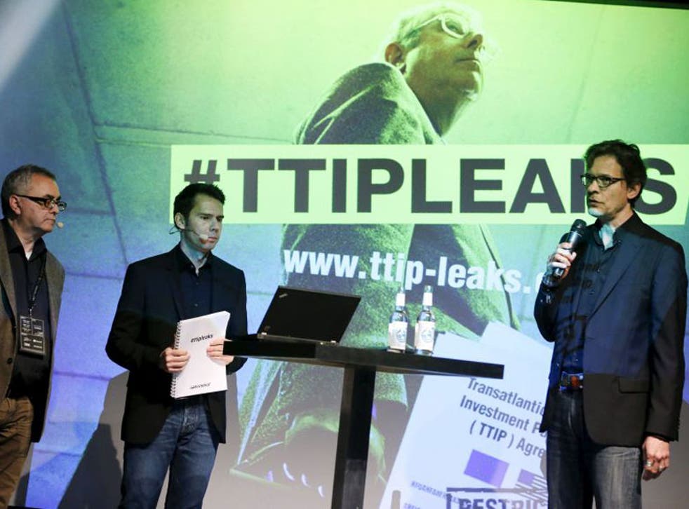 Juergen Knirsch (L-R), Volker Gassner and Stefan Krug of the environmental campaign group Greenpeace address a news conference as they present a copy of the leaked TTIP negotiations in Berlin, Germany, May 2, 2016
