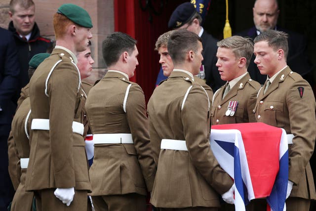 Military colleagues hold the coffin of Captain David Seath at St Margaret's RC Memorial Church in Dunfermline, Scotland
