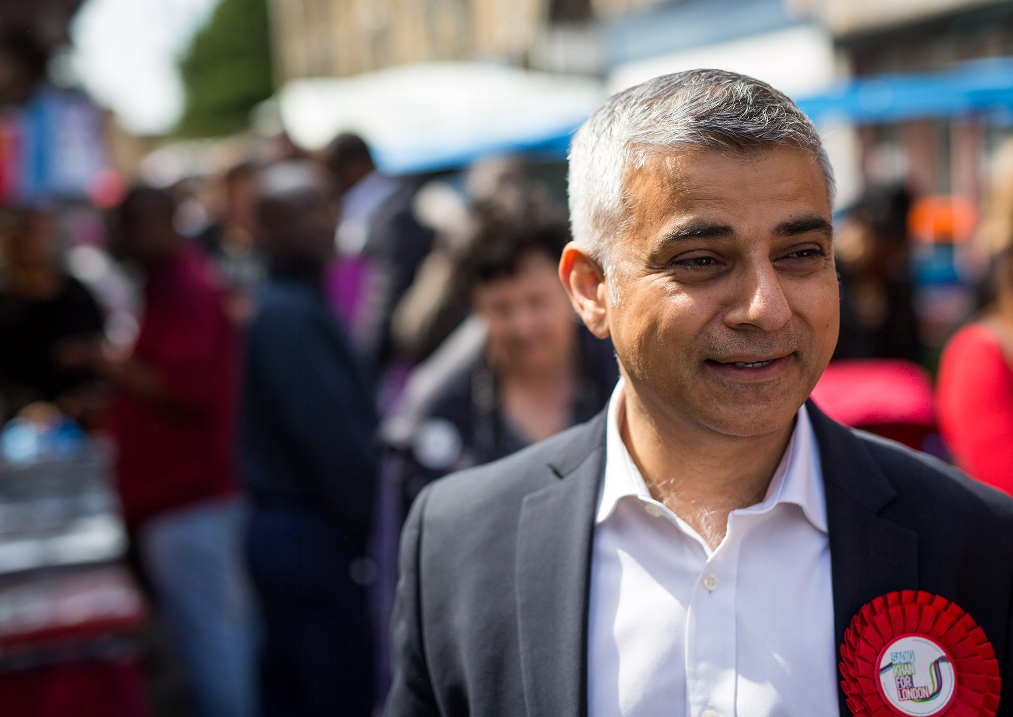 Labour's London Mayoral candidate Sadiq Khan and member of Parliament for Tooting walks through East Street Market in Walworth on May 4, 2016 in London