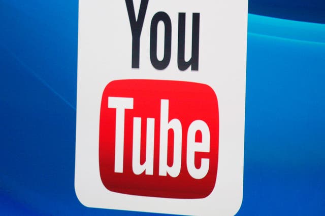 The YouTube logo on screen at E3 2014