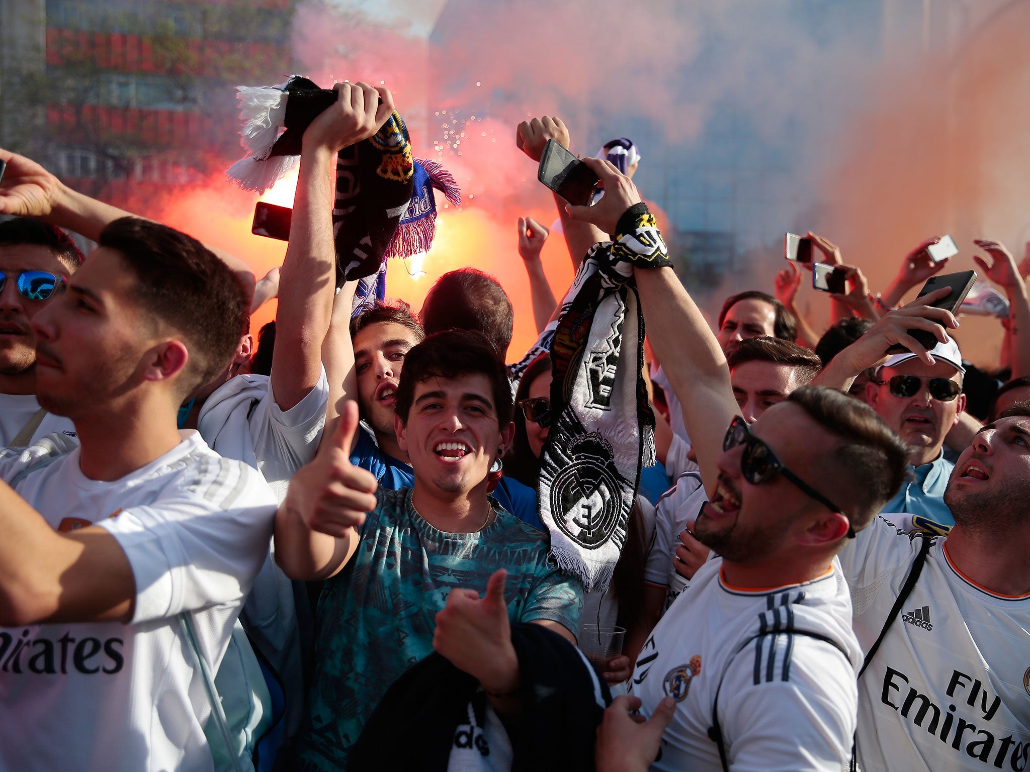 Real Madrid fans welcome their team to the Bernabeu