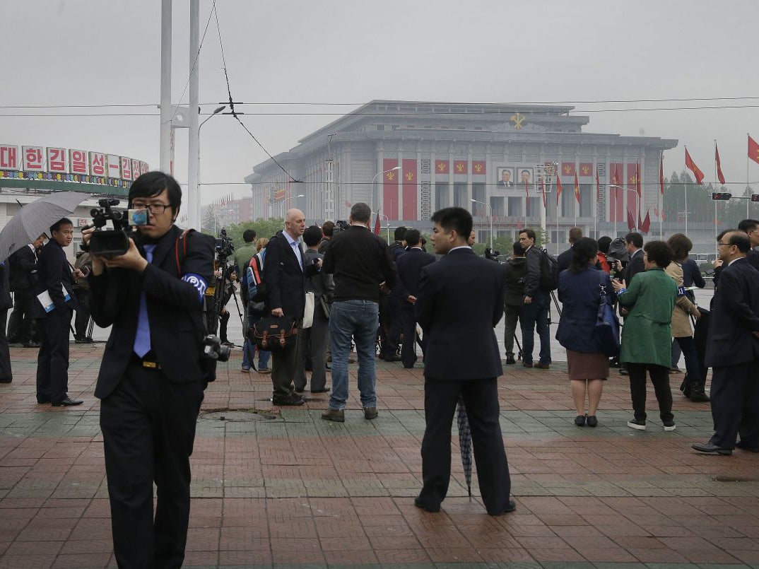 Foreign journalists are seen filming the April 25 House of Culture, the venue for the 7th Congress of the Workers' Party of Korea