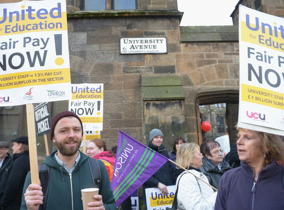 University staff picket gates at Glasgow University during a one day walk out over pay in October 2013