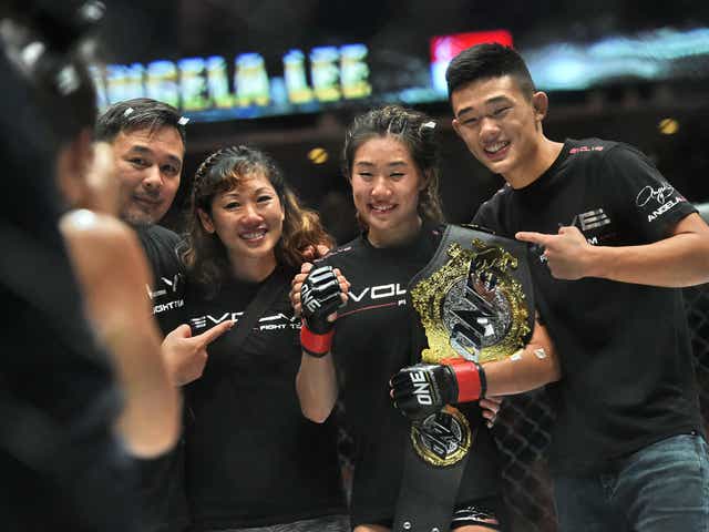 Angela Lee celebrates her victory over Mei Yamaguchi