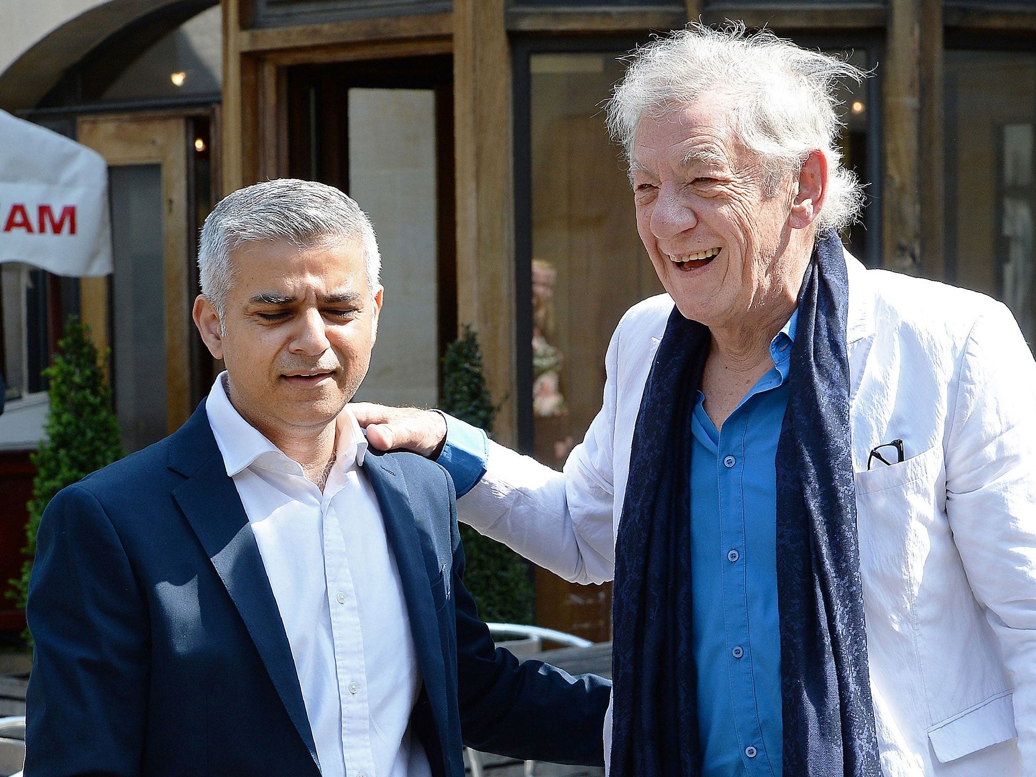 Sadiq Khan is greeted by Ian McKellen as he arrives for his swearing-in ceremony at Southwark Cathedral in London on May 7, 2016.