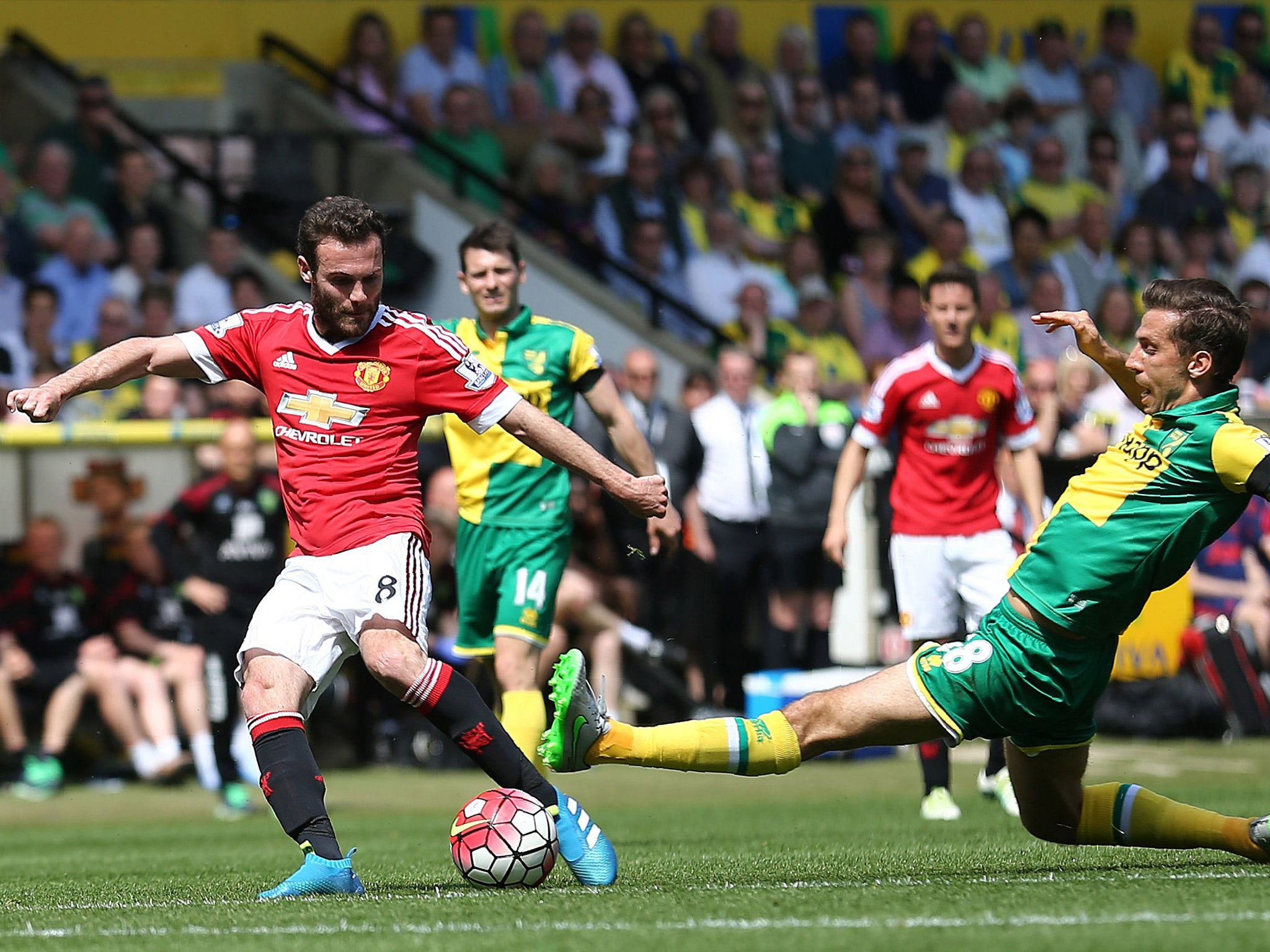 Juan Mata shoots at goal during Manchester United's match with Norwich