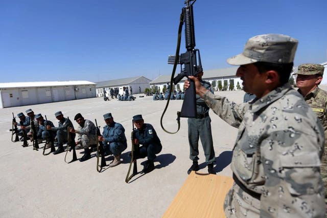 Afghan policemen participate in a training session
