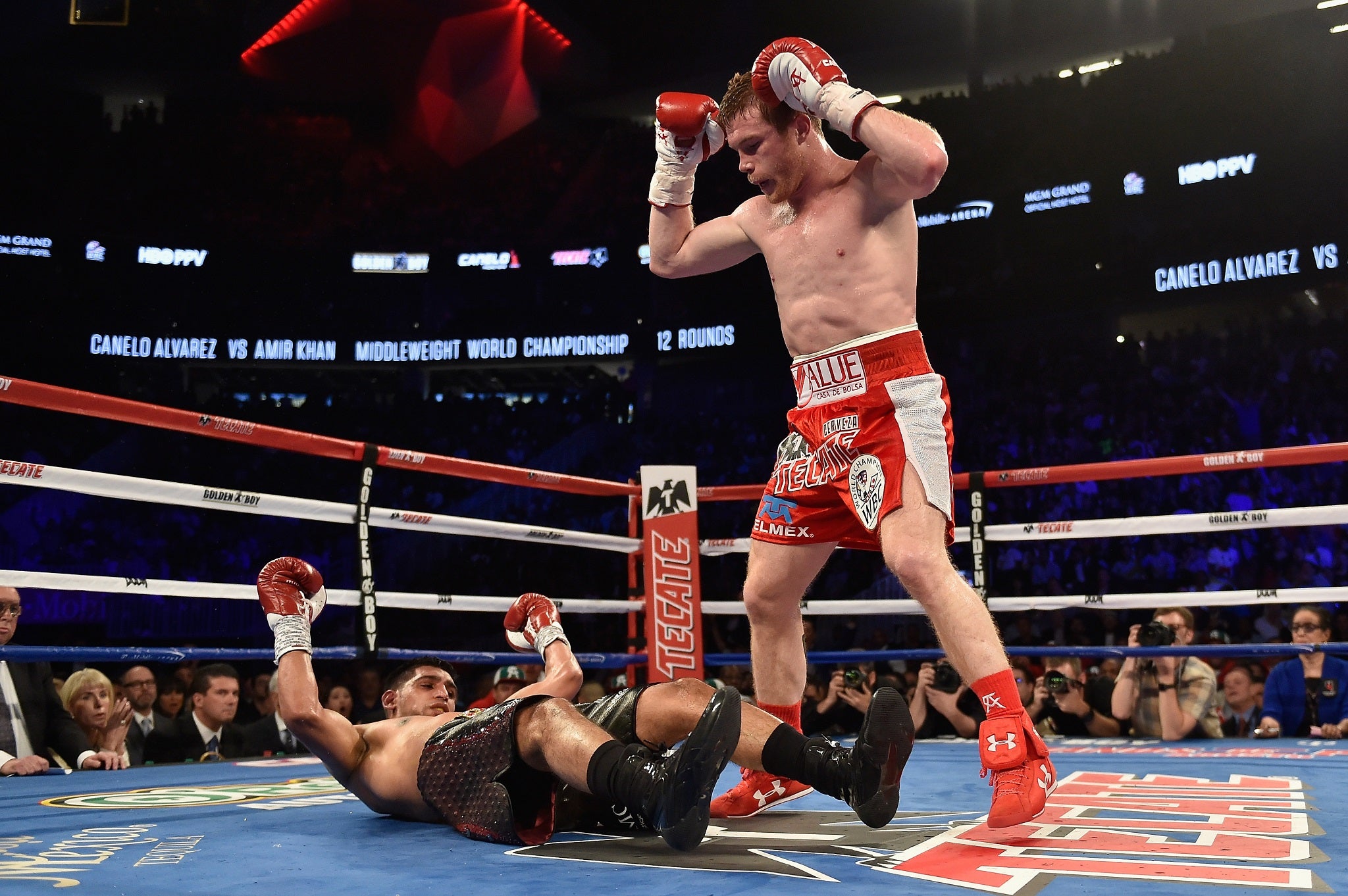 Canelo looked unsure whether to celebrate after seeing Khan hurt