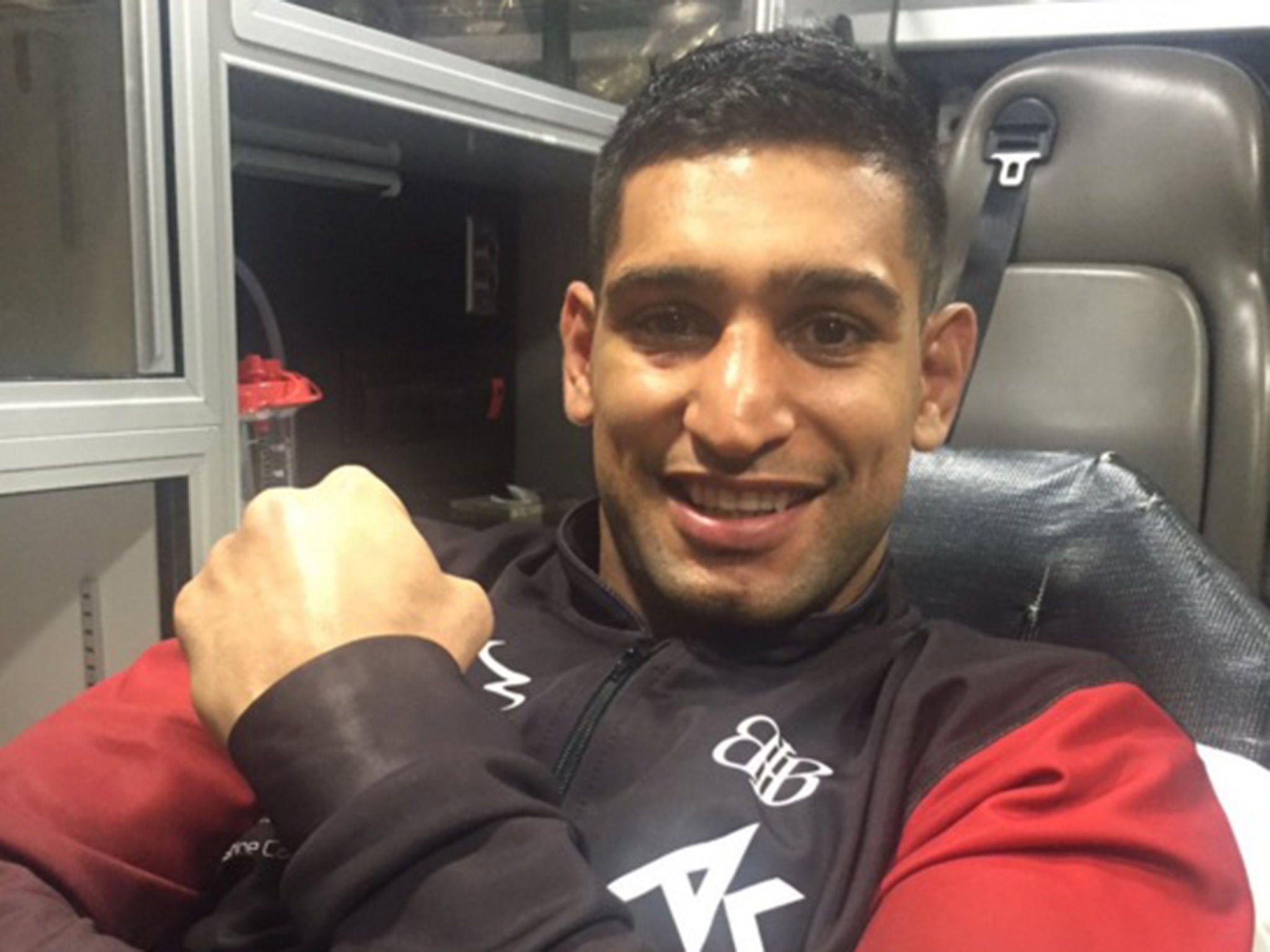 Khan tweeted this image from hospital after the fight