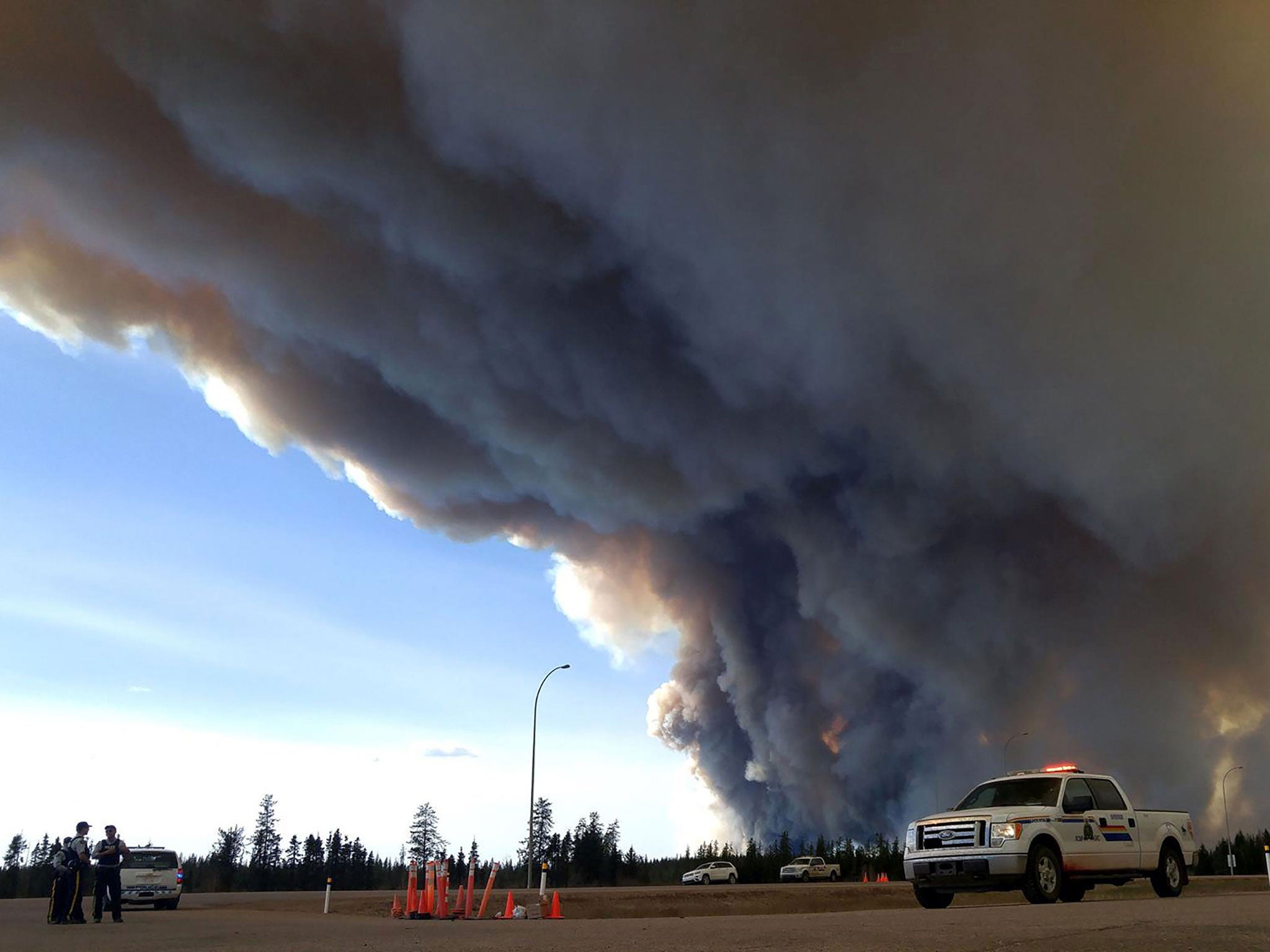 Members of the Alberta Royal Canadian Mounted Police monitor the Fort McMurray Wildfire