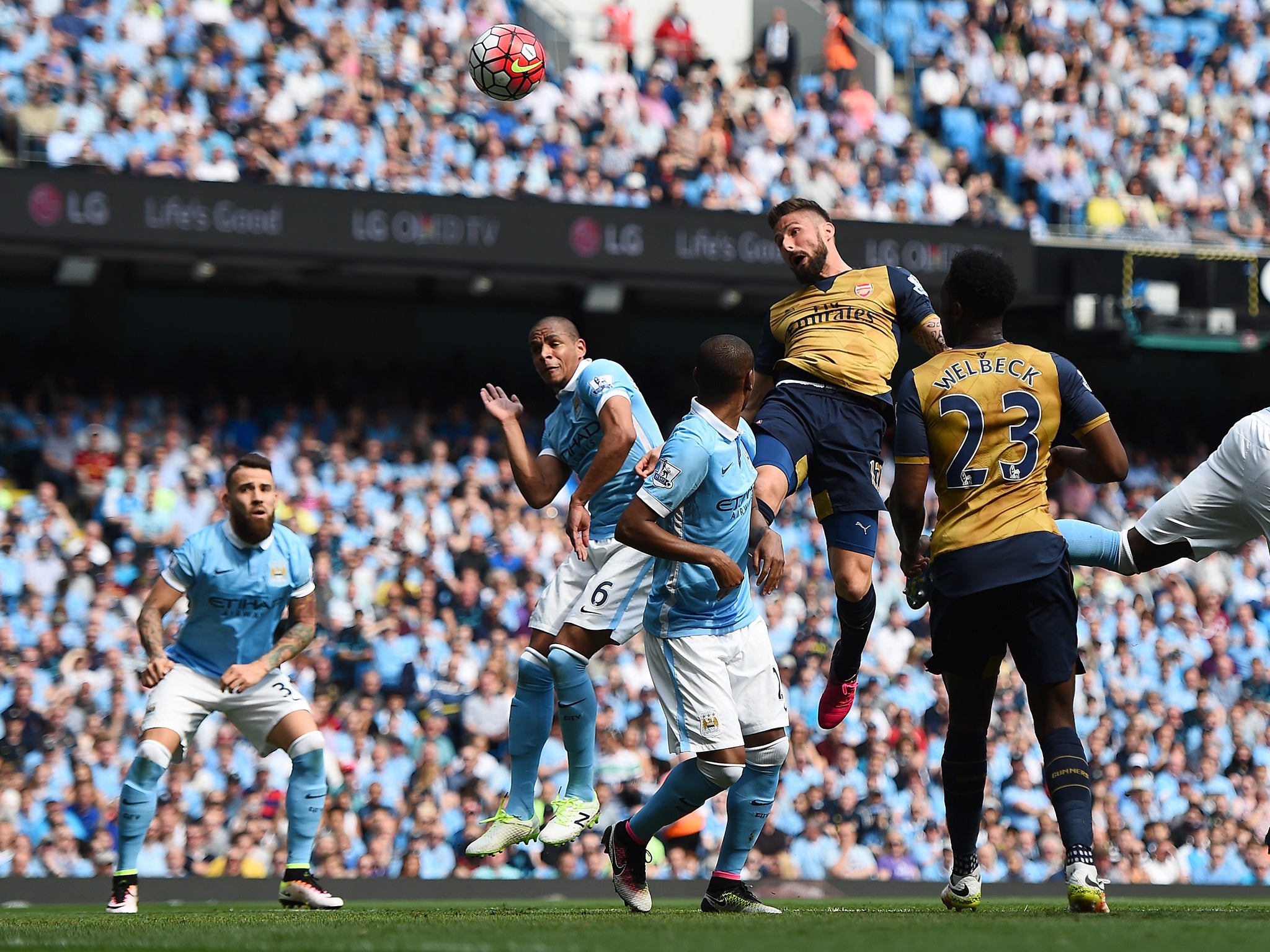 Olivier Giroud heads in Arsenal's first of the game