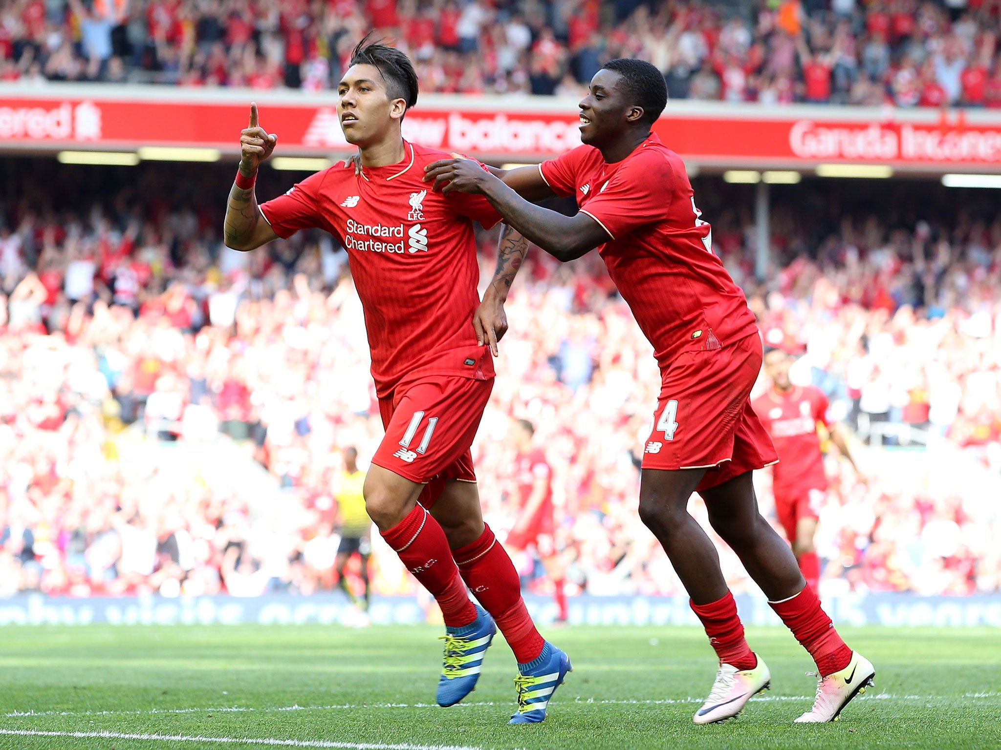 Roberto Firmino celebrates his goal (Getty)